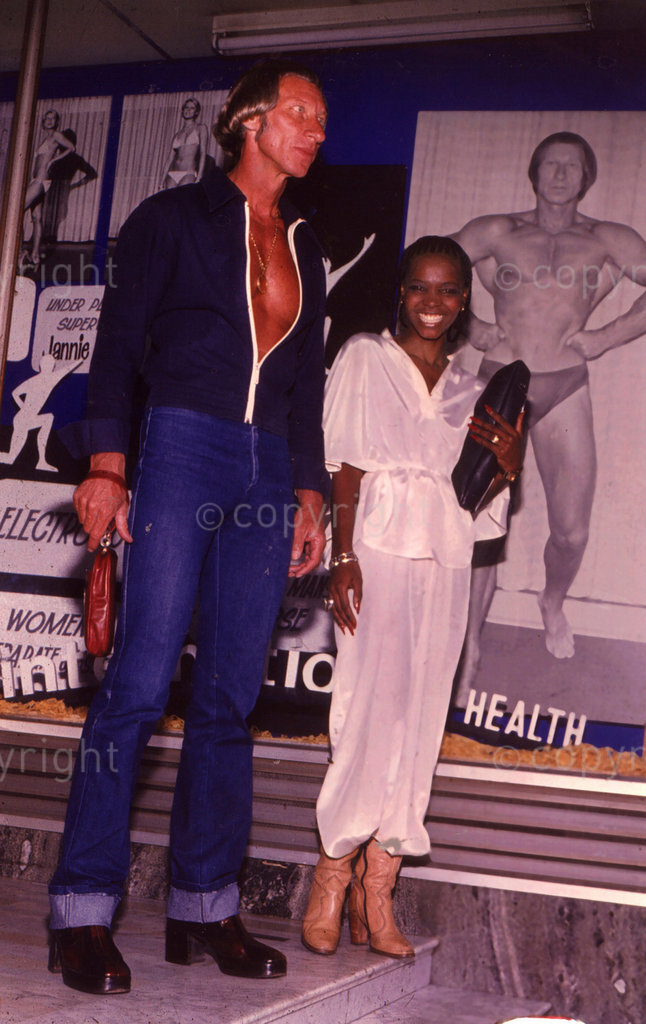 Bubbles Mpondo and Jannie Beetge – At the height of their love (and the publicity) Bubbles and Jannie pose in front of a large picture of Jannie. 