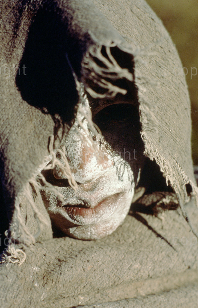 Xhosa initiate cloaked in a blanket.