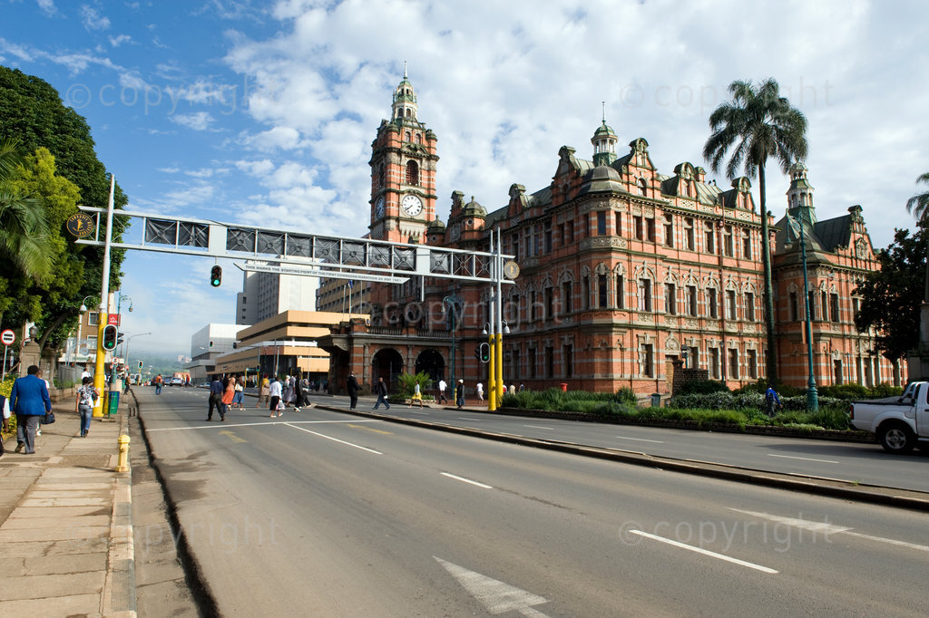 The Arch beside the Pietermaritzburg City Hall is the starting point of the famous Comrades Marathon on the “down run”. This is also the point where the first Comrades Marathon started on the 24th May 1921. 
The present City Hall was built on the site of the Volksraadsaal of the Voortrekkers and completed in 1900. On June 6, 1969, the Pietermaritzburg City Hall was declared a National Monument. It is notable for its fine stained-glass windows Pietermaritzburg City Hall - The largest all-brick building south of the Equator.
