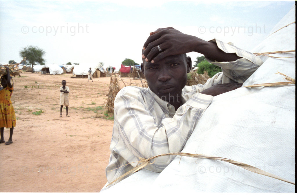 ipjr09440728
September 2004 Kalma IDP Camp Nyala Janub Darfur Sudan
Mansoor, now lives at the Kalma IDP camp he lost his village in a raid.

An IDP (Internially Displaced People) Camp on the outskirts of the town of Nyala.  There are about 80,000 people who have been displaced from their villages by the Janjaweed milita, that raped, murdered and burned and their villages forsing them to leave and seek refuge in IDP camps across the Darfur region of Sudan. The Janjaweed milita is backed by the Government of the Sudan. 

©John Robinson/MCC/South Photographs
africa afrika afrique arab african genocide janjaweed milita armed horsemen. refugees refugee





