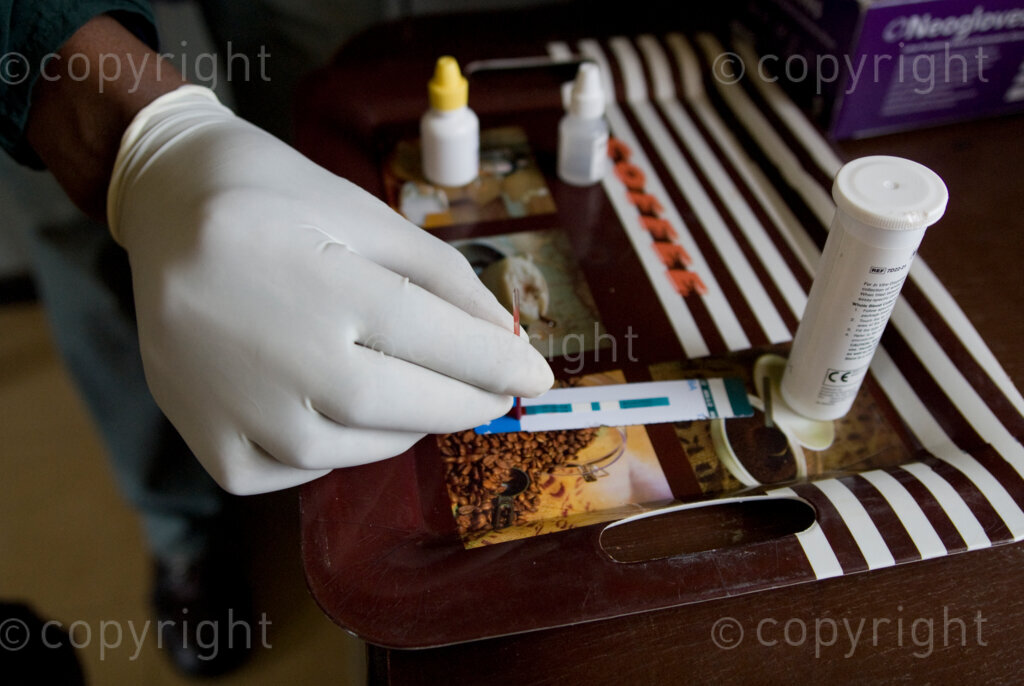 And HIV/Aids counsellor conducts an HIV test at a rural clinic in Lesotho. PHOTO: EVA-LOTTA JANSSON
