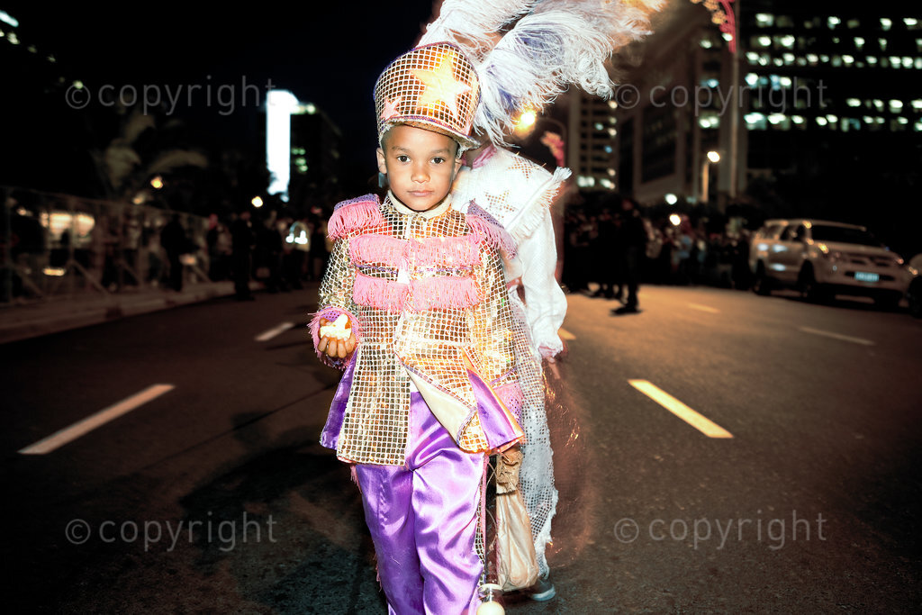 The Kaapse Klopse (or simply Klopse), formerly known as the Coon Carnival and officially called Cape Town Minstrel Carnival, is a Cape coloured minstrel festival that takes place annually on 2 January in Cape Town, South Africa. It is also referred to as Tweede Nuwe jaar (Second New Year). As many as 13,000 minstrels take to the streets garbed in bright colours, either carrying colourful umbrellas or playing an array of musical instruments. The minstrels are self-organised into klopse (