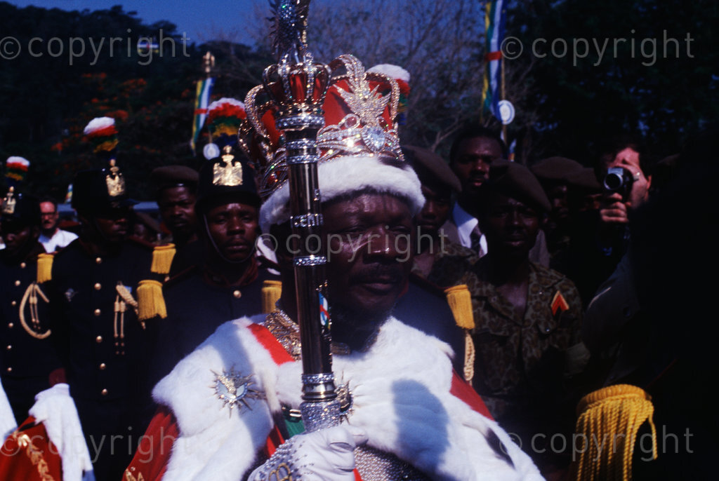 Emperor Bokassa in his field Marshall uniform stands next to his throne as he inspect a passing guard during his coronation on 4th December 1977. (Photo by: Africa 24 Media / Camerapix/Mohamed Amin/Duncan Willetts) ALL RIGHTS RESERVED