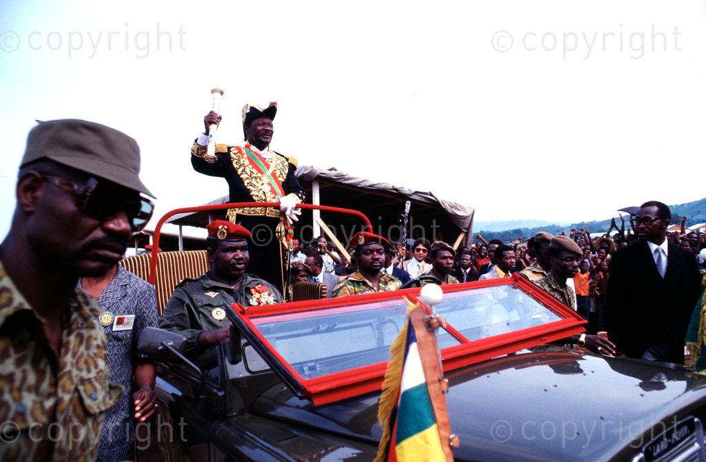 AFRICA,KENYA- Emperor Bokassa raises his sceptre and smiles at his loyal subjects during his coronation ceremony held at Bangui on 4th December 1977. (Photo by: Africa 24 Media / Camerapix/Mohamed Amin/Duncan Willetts) ALL RIGHTS RESERVED