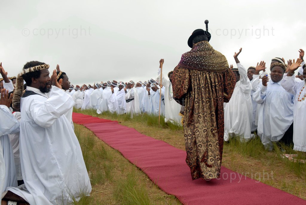 Members of the Shembe faith (Nazareth Baptist Church), a religious hybrid of Christianity and African traditions greet leader Prophet Vimbeni Shembe during the annual pilgrimage up the Nhlangakazi mountain, north of Durban, January 11, 2007. Shembe is the fourth successor to Isaiah Shembe, a Zulu healer who formed the church a century ago to infuse African tribalism into Christianity brought over by Western missionaries. The pilgrims will spend two weeks on the mountain praying and dancing. © Rogan Ward 2007