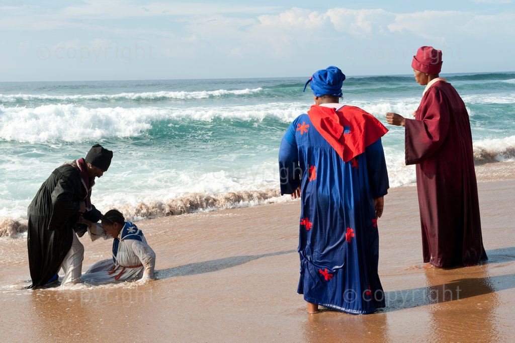 Members of the ZCC church in KwaZulu-Natal perform a Baptism Ceremony in the sea near Sheffield beach on the South Coast. The Zion Christian Church (or ZCC) is one of the largest African initiated churches in southern Africa, with members belonging to ZCC star and members belonging to the saint Engenas ZCC. The church's headquarters are at Zion City Moria in Limpopo Province, South Africa, and the two congregations that compose the church are led by Barnabas Lekganyane and Saint Engenas Lekganyane, the grandsons of its founder.