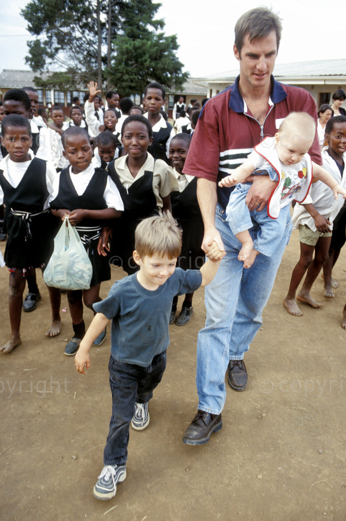 Father and family visit a rural school
