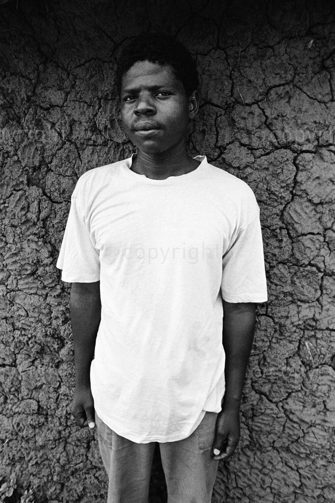 Young man outside house at Khekhe Mthethwa's homestead, KZN