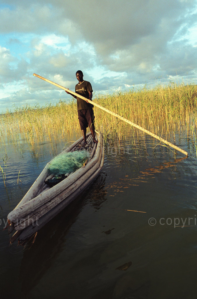 a fisherman with a traditional makoro