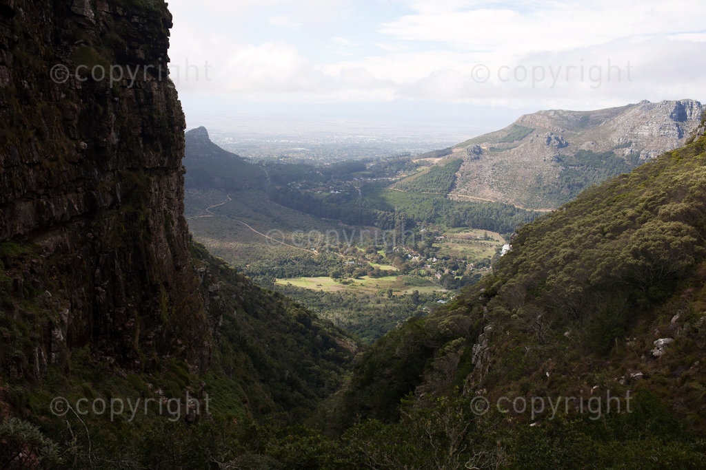 A panoramic view from the top of Myburg's ravine in the Orange Kloof reserve. Hout Bay is seen in the valley with Constantia Nek linking the village to greater Cape Town