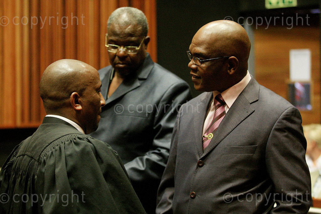 October 2, 2014. Former Crime Intelligence boss Richard Mdluli with his legal representative Ike Motloung and co- accused Mthembini Mthunzi at the Palm Ridge Magistrate's Court. The case was postponed to December 5, to allow the defence to acquire documents they need to proceed with their case. Photo: Veli Nhlapo. Â© Sowetan/ Times Media