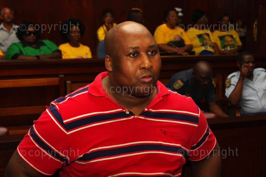 DURBAN - 19 December 2014 - Former Blue Bulls rugby player Phindile Joseph Ntshongwana in the Durban High Court moments before he was due to be sentenced to five terms of life imprisonment by Judge Irfaan Khalil. Ntshongwana was convicted of killing four people with an axe, kidnapping and rapping a woman as well as assaulting two other people. Picture: Giordano Stolley