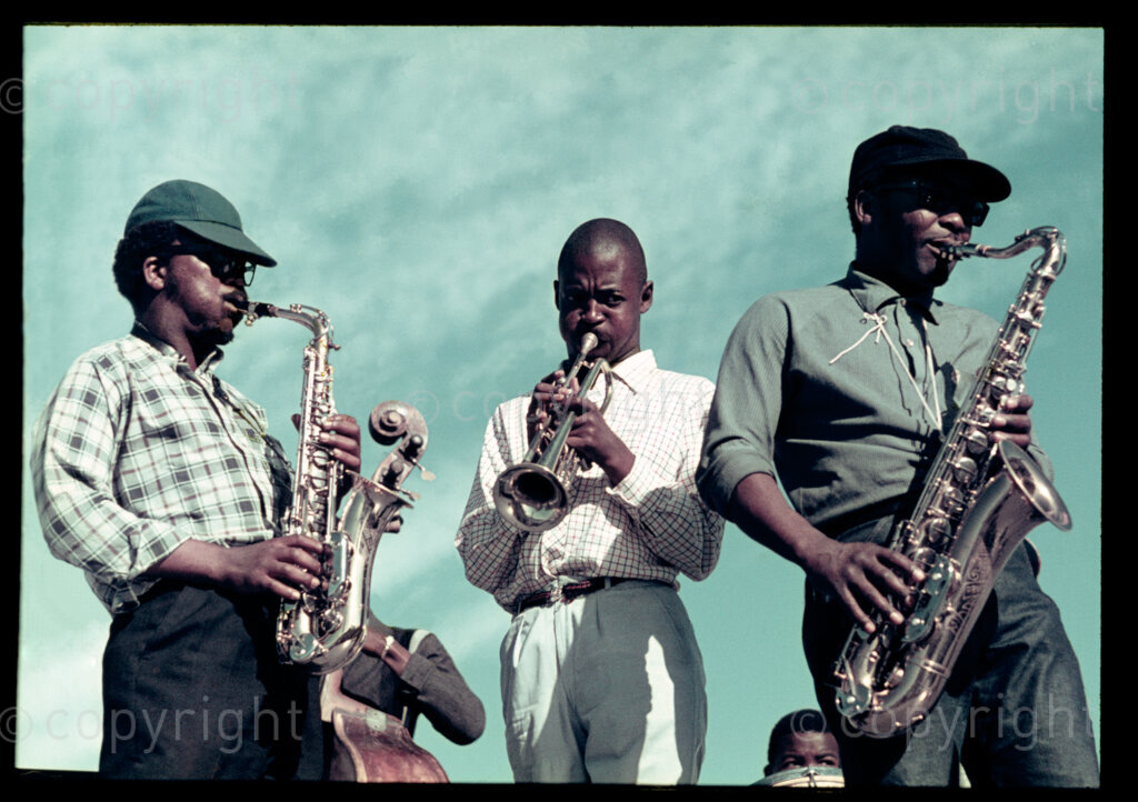 Danayi Dlova (alto), Duke Ngcukana (trumpet), Cups Nkanuka (tenor); Langa Stadium, Langa, Cape Town; c1972.