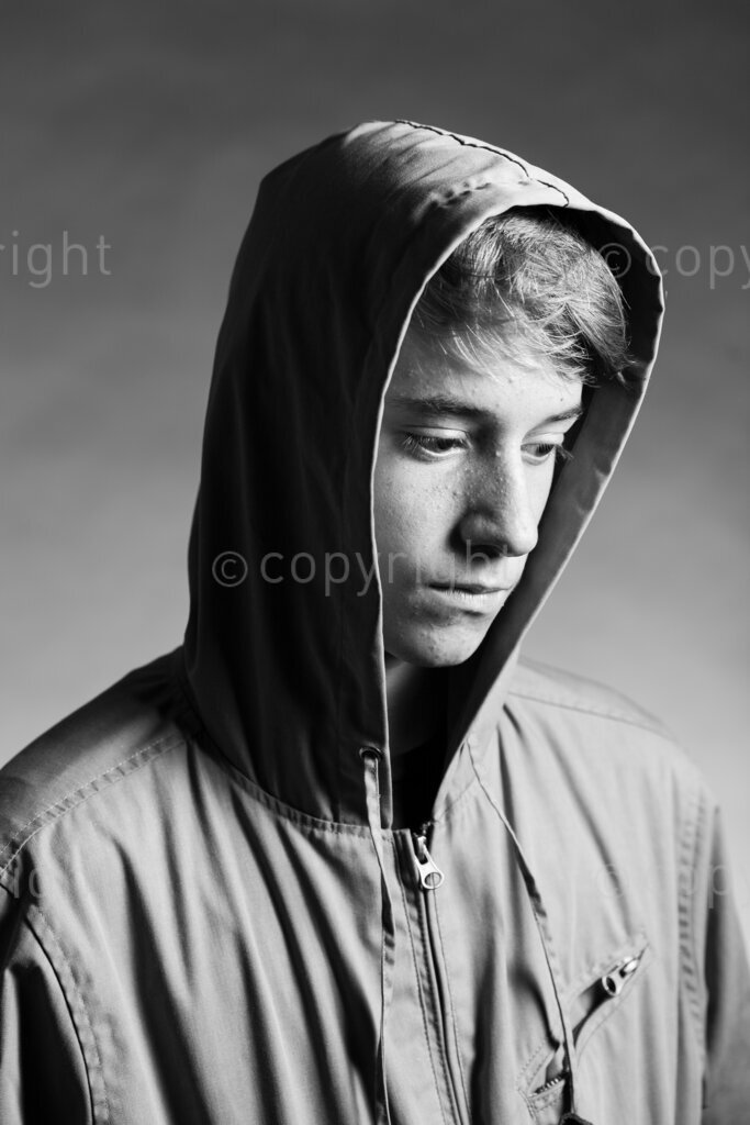 A teenage boy in pensive mood  as he poses in a photography studio at Fish Hoek, Cape Town, Western Cape, South Africa.(Picture: JULIAN GOLDSWAIN)