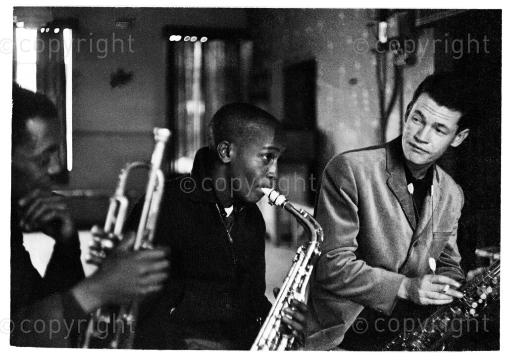 LEFT TO RIGHT Dennis Mpale (trumpet), Barney Rachabane (alto), Ronnie Beer (tenor); Room at the Top, Strand Street, Cape Town; 1964.