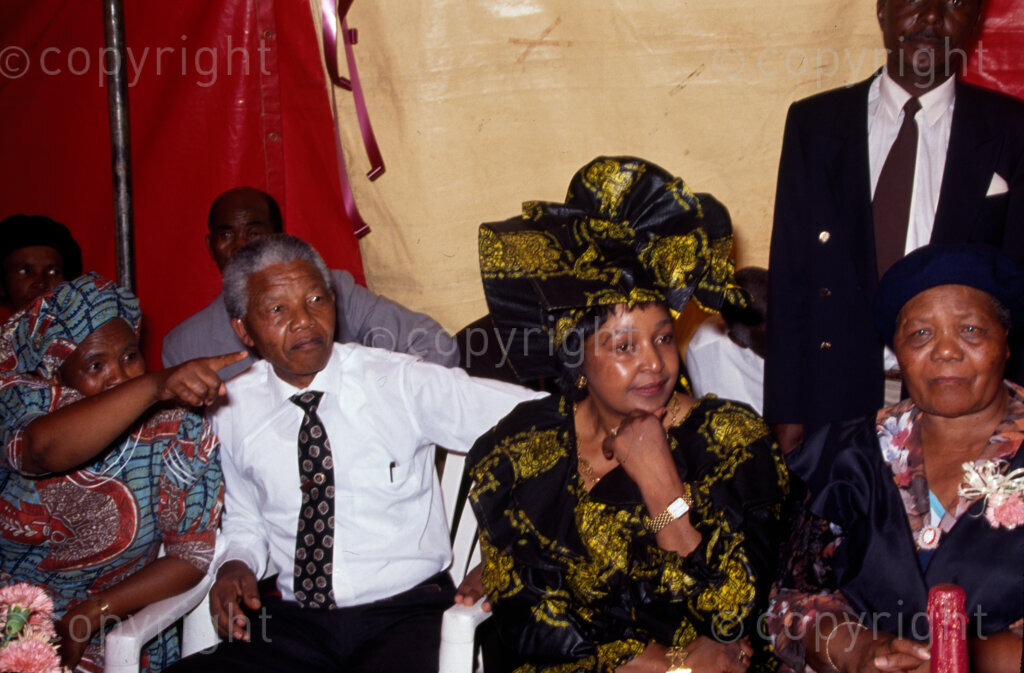 Nelson Mandela and Winnie Mandela at daughter Zindzi's engagement to first husband, Zwelibanzi Hlongwane. The couple got married in 1992. 
Photo by Alf Kumalo / african.pictures