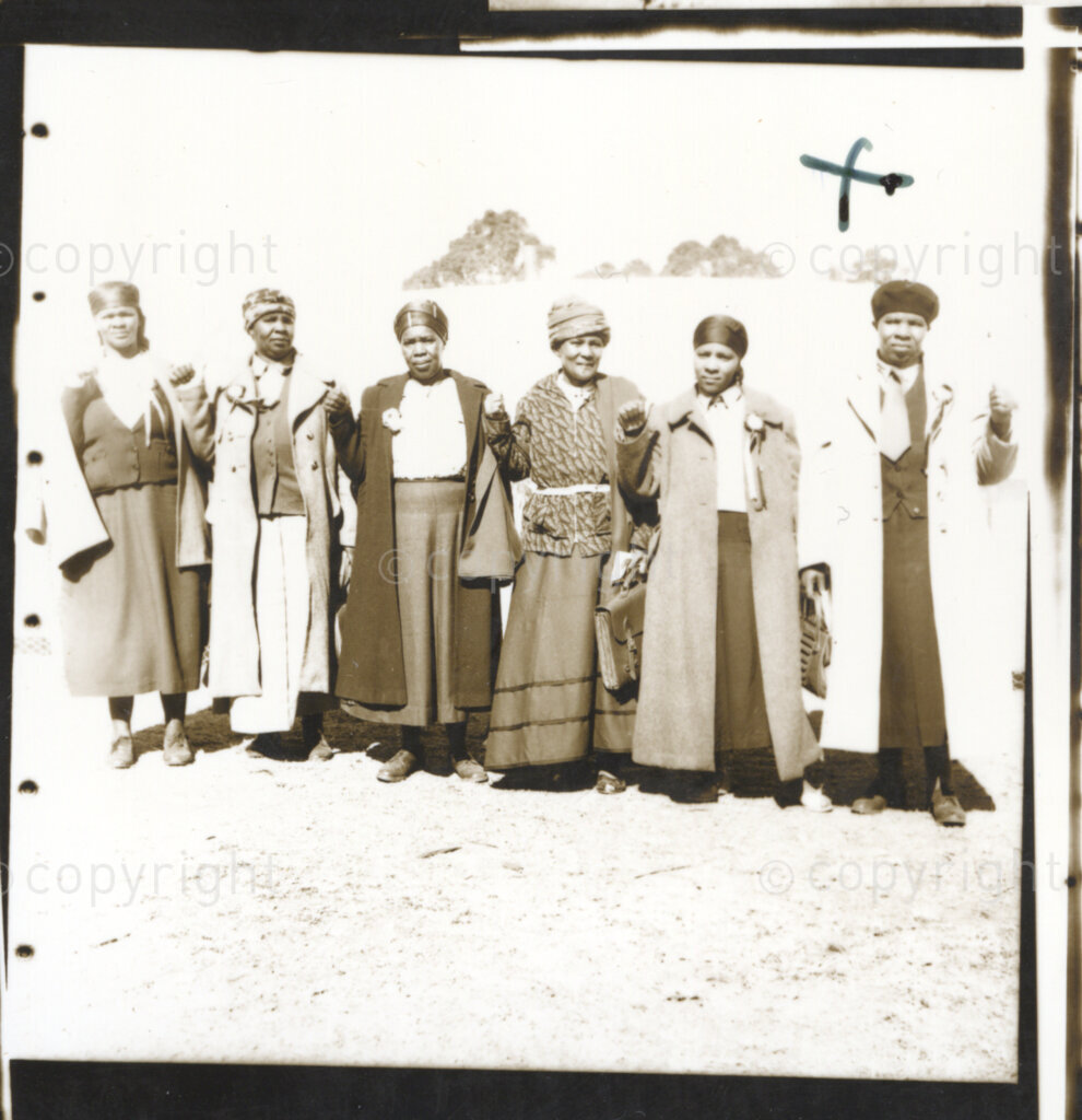 Kliptown, Johannesburg, Transvaal (now Gauteng), South Africa, 19550625. PHOTO: Eli Weinberg.
Six women make the thumbs up salute the sign for unity initiated by the African National Congress (ANC) in the Cape in 1949. They are delegates attending the Congress of the People held in Kliptown, Johannesburg on June 25 and 26th June 1955. The Freedom Charter was adopted at this Congress.
