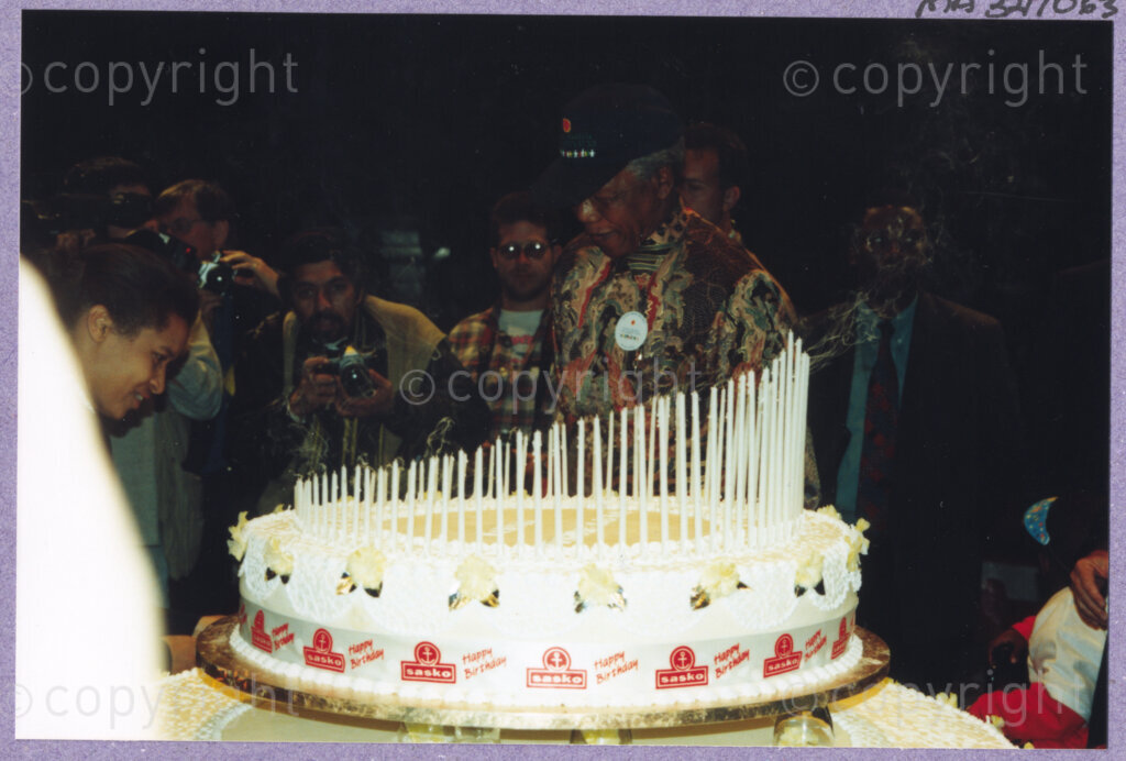 Hilton College, Pietermaritzburg, KwaZulu-Natal, South Africa, 19960717. PHOTO: ANC Archives.

The President of South Africa, Nelson Mandela is delighted to be able to share his 100kg birthday cake, ablaze with 78 candles, with invited children and their carers, the circus performers and other assembled guests at his 78th birthday celebration. More than 2,000 children who are living with disability in disadvantaged communities across the county have been invited to the day-long birthday extravaganza being held on the 17th July 1996 on the grounds of Hilton College near Pietermaritzburg in the KwaZulu-Natal Midlands. The event has the backing of the Nelson Mandela Children's Fund.