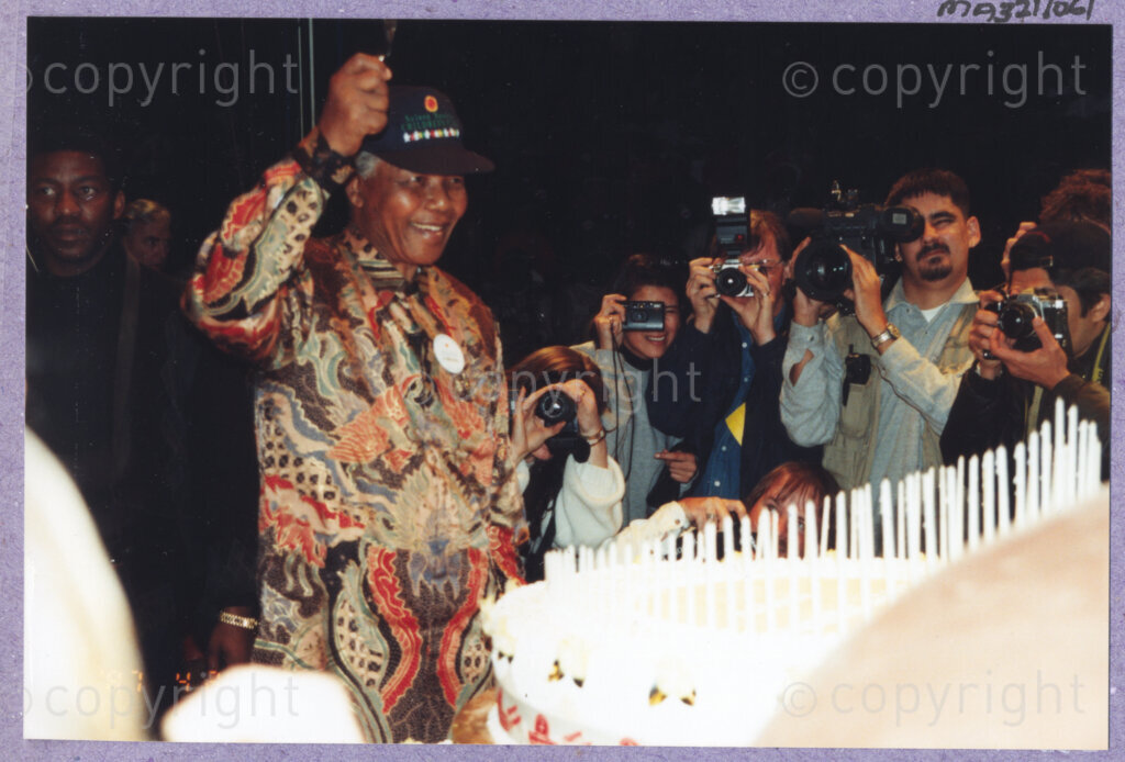 Hilton College, Pietermaritzburg, KwaZulu-Natal, South Africa, 19960717. PHOTO: ANC Archives.

The President of South Africa, Nelson Mandela, fondly known as Madiba, celebrates his 78th birthday with more than 2,000 children who are living with disability in disadvantaged communities across the county. The day-long birthday extravaganza is being held on the 17th July 1996 on the grounds of Hilton College near Pietermaritzburg in the KwaZulu-Natal Midlands. Madiba was delighted to be able to share his 100kg birthday cake, ablaze with 78 candles, with the children and their carers, the circus performers and other assembled guests. The event has the backing of the Nelson Mandela Children's Fund.