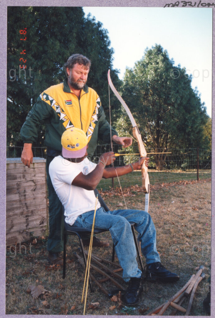 Hilton College, Pietermaritzburg, KwaZulu-Natal, South Africa, 19960717. PHOTO: ANC Archives.

A young disabled boy is taught archery at the 78th birthday celebration of the President of South Africa, Nelson Mandela, fondly known as Madiba. More than 2,000 children who are living with disability in disadvantaged communities across the county were invited to attend the day-long birthday extravaganza on the 17th July 1996 on the grounds of Hilton College near Pietermaritzburg in the KwaZulu-Natal Midlands. The children, their carers, Madiba and other guests are being entertained playing games, enjoying party fare, and attending a circus performance in a big top (a first-time experience for Madiba who has, to date, never been to a circus!). The event has the backing of the Nelson Mandela Children's Fund.
