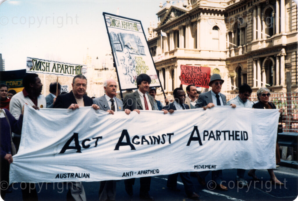 Australia, Date Unknown. PHOTO: ANC Archives.

The Australian Anti-Apartheid Movement stood with the African National Congress (ANC) and others in condemning apartheid in South Africa. Such pressure of civil society on the governments around the world brought pressure on the apartheid regime.  Australian marchers take to the street in protest.
Banner: Act Against Apartheid - Australian Anti-Apartheid Movement; Smash Apartheid; Condemn Apartheid Aggression; Four South Africans die of malnutrition every hour...