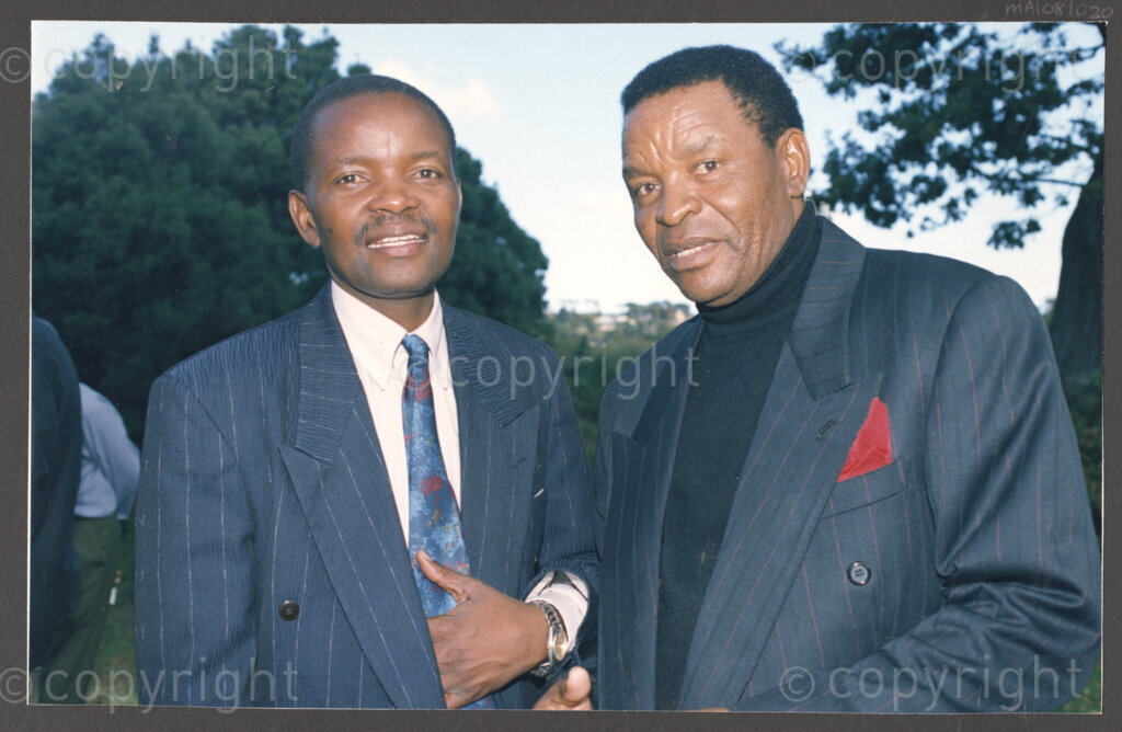 Cape Town, Western Cape, South Africa, 19970418. PHOTO: ANC Archives.

Kgosi S. Victor Suping (right) from the North West Province with an unidentified man at the social function following the inauguration of the National Council of Traditional Leaders in Cape Town, Western Cape, South Africa on 18 April 1997.