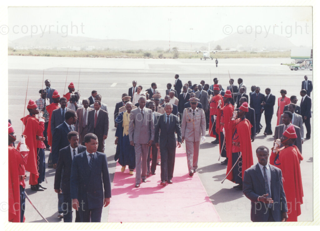 Senegal, 19920601. PHOTO: ANC Archives.

Nelson Mandela (right) is seen walking on a red carpet with Senegalese president, Abdou Diouf (left) on his arrival in Senegal in June 1992.