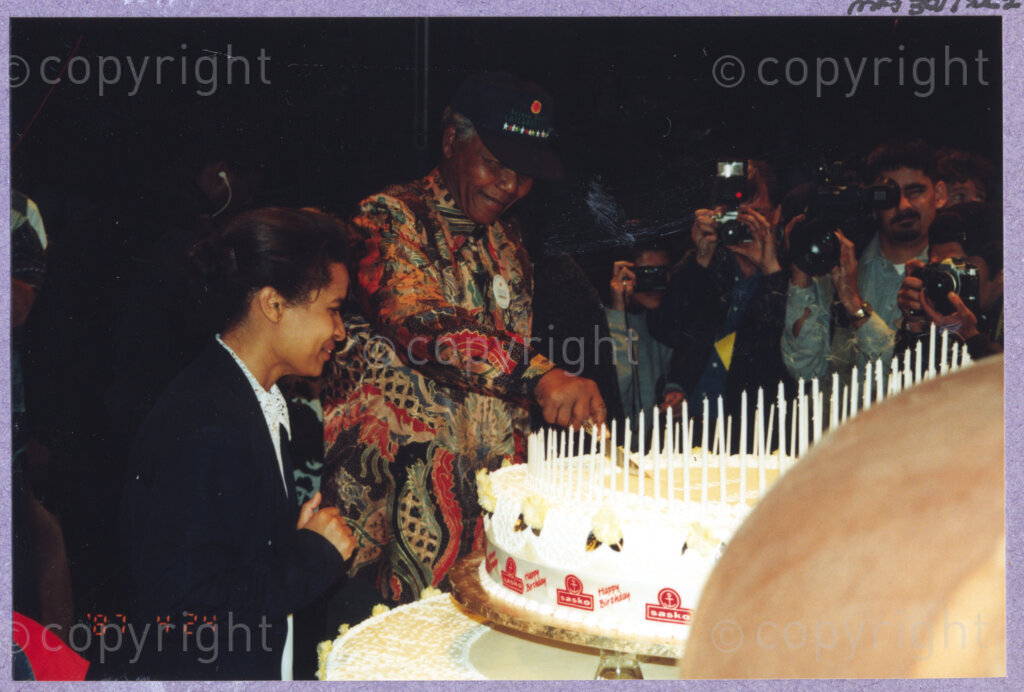 Hilton College, Pietermaritzburg, KwaZulu-Natal, South Africa, 19960717. PHOTO: ANC Archives.

The President of South Africa, Nelson Mandela, was delighted to be able to share his 100kg birthday cake, ablaze with 78 candles, with his guests at his 78th birthday celebration. More than 2,000 children who are living with disability in disadvantaged communities across the county have been invited to the day-long birthday extravaganza being held on the 17th July 1996 on the grounds of Hilton College near Pietermaritzburg in the KwaZulu-Natal Midlands. The event has the backing of the Nelson Mandela Children's Fund.