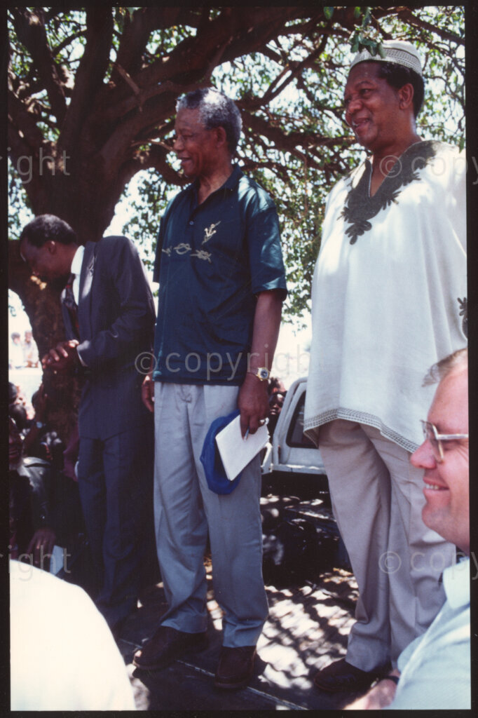 Maila Mapitsane village, Sekhukhuneland region, Transvaal, South Africa, 19921130. PHOTO: ANC Archives.

The President of the African National Congress, Nelson Mandela (centre) stands next to the Chairman of Operational Hunger, Michael Rantho (right) in the village of Maila Mapitsane in the Sekhukhuneland region in November 1992.