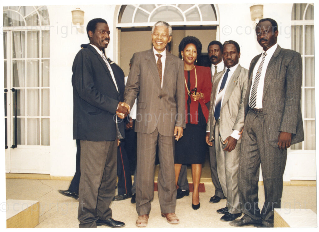 Senegal, 19920601. PHOTO: ANC Archives.

A group photograph with Nelson Mandela (second from left) greeting an unidentified man (first from left), during his visit to Senegal in June 1992.