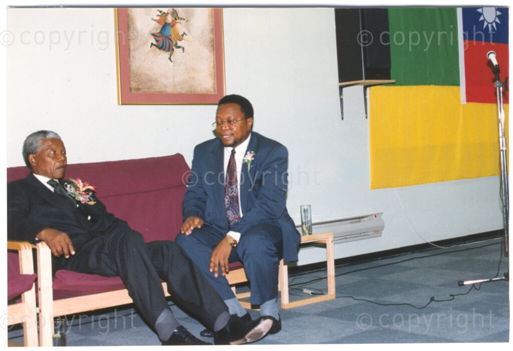 Parktonian Hotel, Johannesburg, Transvaal, South Africa, 19940309. PHOTO: ANC Archives.

The President of the African National Congress (ANC), Nelson Mandela (left) sits chatting with a colleague at an ANC voter education fund-raising dinner hosted by the Taiwanese community in South Africa on the 9 March 1994. Leading up to the 1994 elections in South Africa, Taiwan embarked on a public relations campaign in efforts to improve relations with the ANC, providing financial support to the ANC's election campaign. South Africa's diplomatic ties with Taiwan (The Republic of China) ended in 1998 however when Nelson Mandela, as President of South Africa, recognized the People's Republic of China.