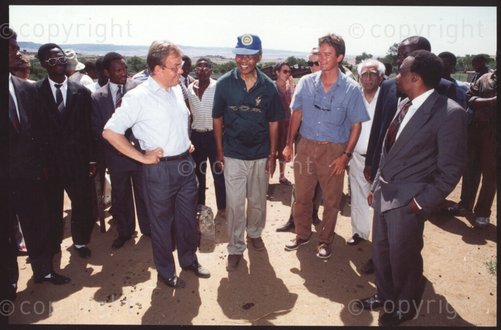 Jane Furse Agricultural Centre , Jane Furse, Sekhukhuneland, Transvaal, South Africa, 19921130. PHOTO: ANC Archives.

Carl Niehaus of the African National Congress (ANC) (left in the white shirt), the President of the ANC, Nelson Mandela (centre), and Operation Hunger Regional Director (for the Northern Transvaal), Johann Rissik (right in the blue shirt) chat about Operation Hunger's food security program at the Jane Furse Agricultural Centre in the town of Jane Furse, Sekhukhuneland in November 1992.