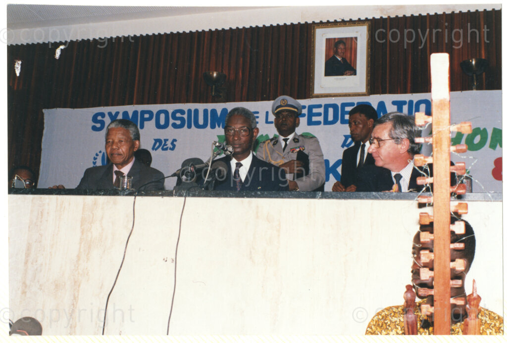 Senegal, 19920601. PHOTO: ANC Archives.

Nelson Mandela (left) is seated next to Senegalese President, Abdou Diouf (centre) and an unidentified man (right), during Mandela's visit to Senegal in June 1992, possibly during the Twenty-Eighth Assembly of Heads of States and Government of the Organisation of African Unity (OAU) in Dakar.
