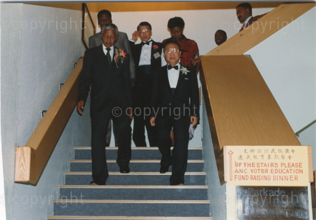 Parktonian Hotel, Johannesburg, Transvaal, South Africa, 19940309. PHOTO: ANC Archives.

The President of the African National Congress (ANC), Nelson Mandela (left) descends the stairway with Taiwanese officials at an ANC voter education fund-raising dinner hosted by the Taiwanese community in South Africa on the 9 March 1994. Leading up to the 1994 elections in South Africa, Taiwan embarked on a public relations campaign in efforts to improve relations with the ANC, providing financial support to the ANC's election campaign. South Africa's diplomatic ties with Taiwan (The Republic of China) ended in 1998 however when Nelson Mandela, as President of South Africa, recognized the People's Republic of China.