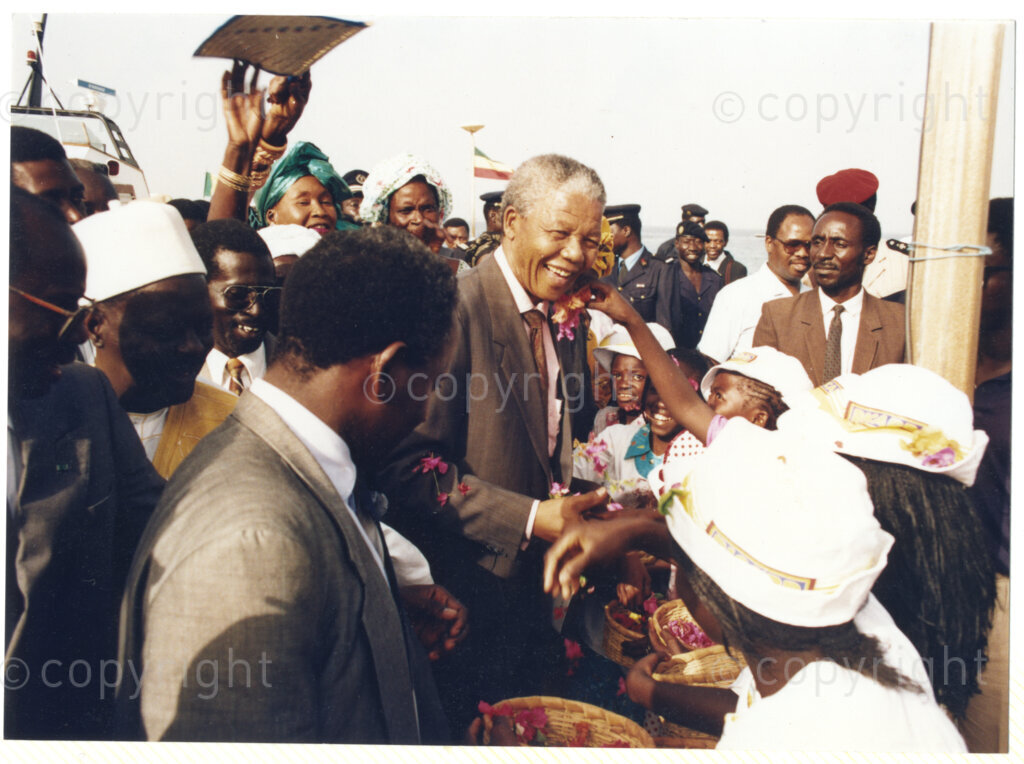 Senegal, 19920601. PHOTO: ANC Archives.

Nelson Mandela (Centre) is seen greeting children on his arrival in Senegal in June 1992.