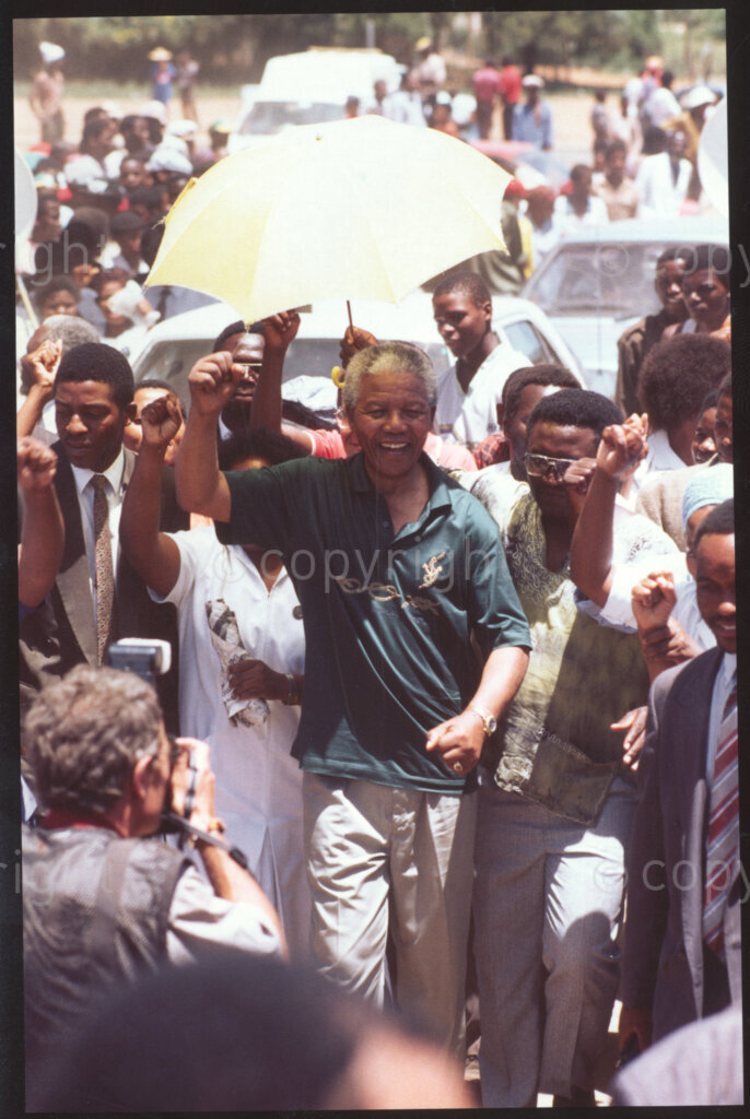 Jane Furse Hospital, Jane Furse, Sekhukhuneland, Transvaal, South Africa, 19921130. PHOTO: ANC Archives.

Crowds escort the President of the African National Congress (ANC), Nelson Mandela (centre), through the grounds of the Jane Furse Hospital on a visit to the town in November 1992.