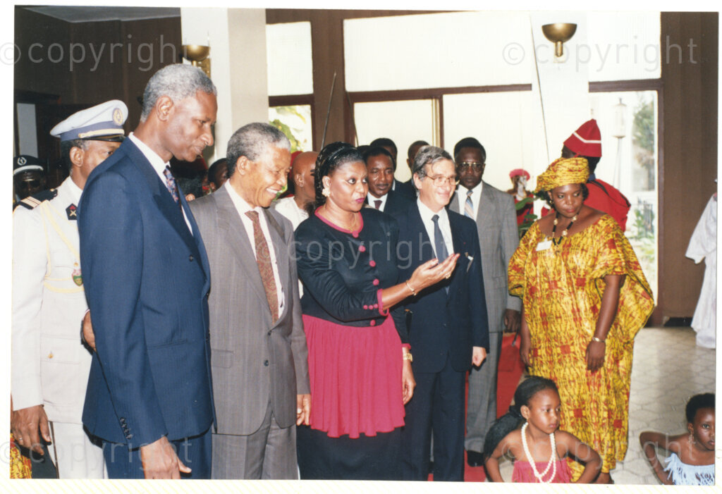 Senegal, 19920601. PHOTO: ANC Archives.

Abdou Diouf (left) is seen standing next to Nelson Mandela (second from left) and other unidentified people (some in traditional clothes) during Mandela's official visit to Senegal in June 1992.