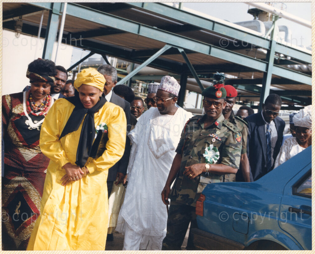 Kaduna Refinery, Kaduna, Kaduna, Nigeria, 19900515. PHOTO: ANC Archives.

Winnie Madikizela-Mandela (left) with Nelson Mandela to her left during their visit to Kaduna Refinery, Nigeria, 15 May 1990.
