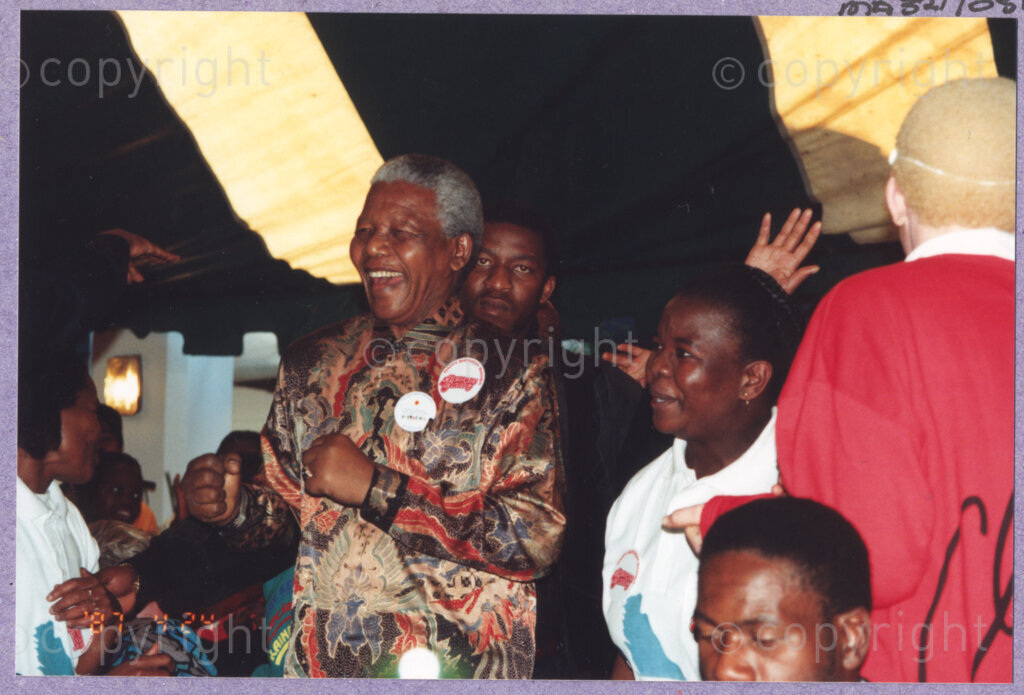 Hilton College, Pietermaritzburg, KwaZulu-Natal, South Africa, 19960717. PHOTO: ANC Archives.

The President of South Africa, Nelson Mandela, fondly known as Madiba, dances with guests as he celebrates his 78th birthday. More than 2,000 children who are living with disability in disadvantaged communities across the county have been invited to the day-long birthday extravaganza being held on the 17th July 1996 on the grounds of Hilton College near Pietermaritzburg in the KwaZulu-Natal Midlands. The children and their carers have been treated to a number of festive activities. The event has the backing of the Nelson Mandela Children's Fund.