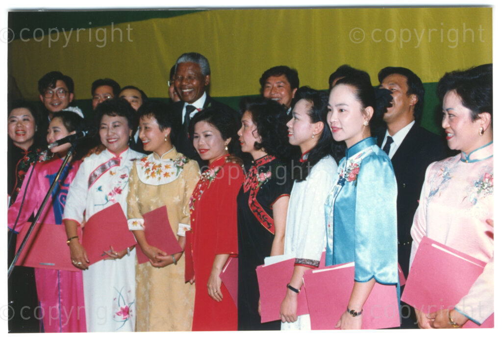 Parktonian Hotel, Johannesburg, Transvaal, South Africa, 19940309. PHOTO: ANC Archives.

The President of the African National Congress (ANC), Nelson Mandela, stands together with other invited Taiwanese guests at an ANC voter education fund-raising dinner hosted by the Taiwanese community in South Africa on the 9 March 1994. Leading up to the 1994 elections in South Africa, Taiwan embarked on a public relations campaign in efforts to improve relations with the ANC, providing financial support to the ANC's election campaign. South Africa's diplomatic ties with Taiwan (The Republic of China) ended in 1998 however when Nelson Mandela, as President of South Africa, recognized the People's Republic of China.