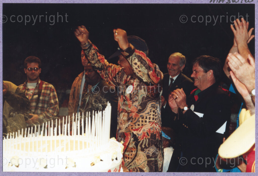 Hilton College, Pietermaritzburg, KwaZulu-Natal, South Africa, 19960717. PHOTO: ANC Archives.

The President of South Africa, Nelson Mandela, fondly known as Madiba, is delighted to be able to share his 100kg birthday cake, ablaze with 78 candles, with the children and their carers, and other invited guests at his 78th birthday celebration. More than 2,000 children who are living with disability in disadvantaged communities across the county have been invited to the day-long birthday extravaganza being held on the 17th July 1996 on the grounds of Hilton College near Pietermaritzburg in the KwaZulu-Natal Midlands. The event has the backing of the Nelson Mandela Children's Fund.