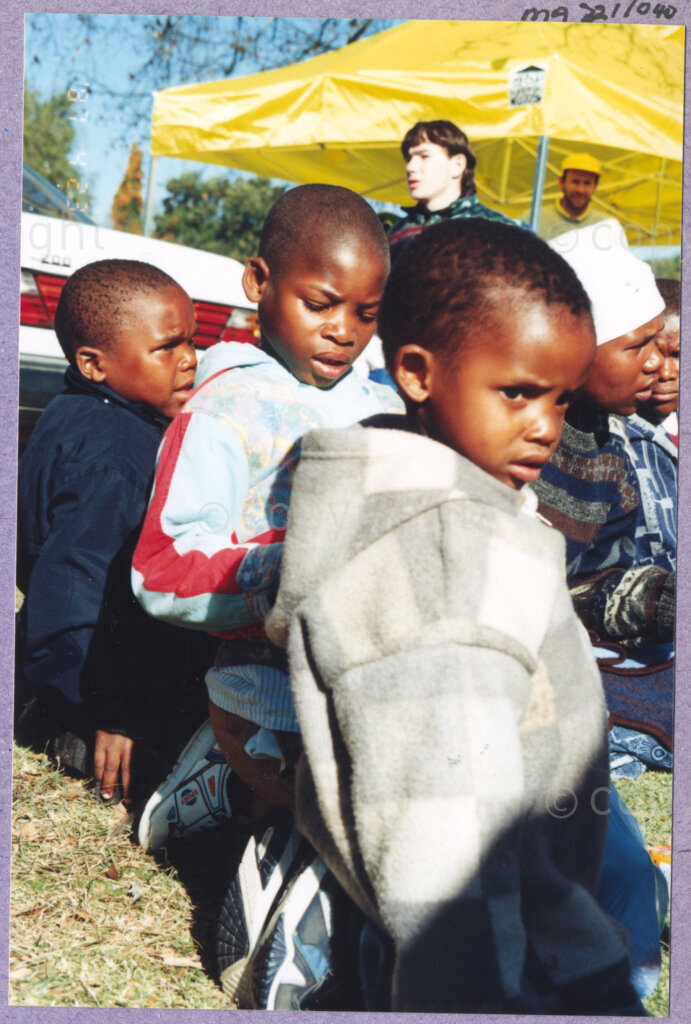 Hilton College, Pietermaritzburg, KwaZulu-Natal, South Africa, 19960717. PHOTO: ANC Archives.

Small children sit on the grass in the winter sunshine at the 78th birthday celebration of the President of South Africa, Nelson Mandela. More than 2,000 children who are living with disability in disadvantaged communities across the county have been invited to attend the day-long birthday extravaganza being held on the 17th July 1996 on the grounds of Hilton College near Pietermaritzburg in the KwaZulu-Natal Midlands. In advance of today's festivities, the invited children have been examined and treated by a team of orthopaedic specialists and physiotherapists. Many of them have been given life-changing wheelchairs. The event has the backing of the Nelson Mandela Children's Fund. Nelson Mandela was born on the 18th July 1918 in Mvezo, a small village in the Eastern Cape.