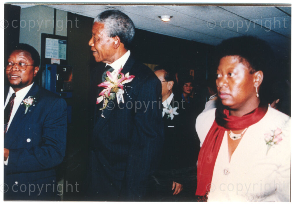 Parktonian Hotel, Johannesburg, Transvaal, South Africa, 19940309. PHOTO: ANC Archives.

The President of the African National Congress (ANC), Nelson Mandela (centre), flanked by two colleagues, arrives at an ANC voter education fund-raising dinner hosted by the Taiwanese community in South Africa on the 9 March 1994. Leading up to the 1994 elections in South Africa, Taiwan embarked on a public relations campaign in efforts to improve relations with the ANC, providing financial support to the ANC's election campaign. South Africa's diplomatic ties with Taiwan (The Republic of China) ended in 1998 however when Nelson Mandela, as President of South Africa, recognized the People's Republic of China.