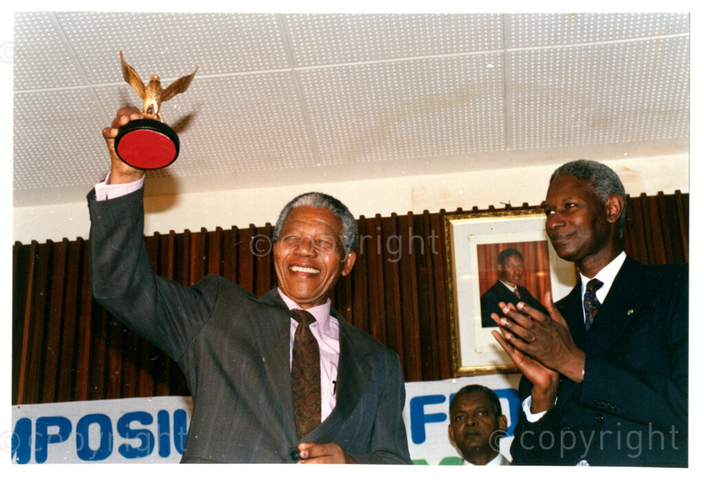 Senegal, 19920601. PHOTO: ANC Archives.

Nelson Mandela (left), receiving an award from Senegalese President, Abdou Diouf (Right), during his official visit to Senegal in June 1992, possibly during the Twenty-Eighth Assembly of Heads of States and Government of the Organisation of African Unity (OAU) in Dakar.