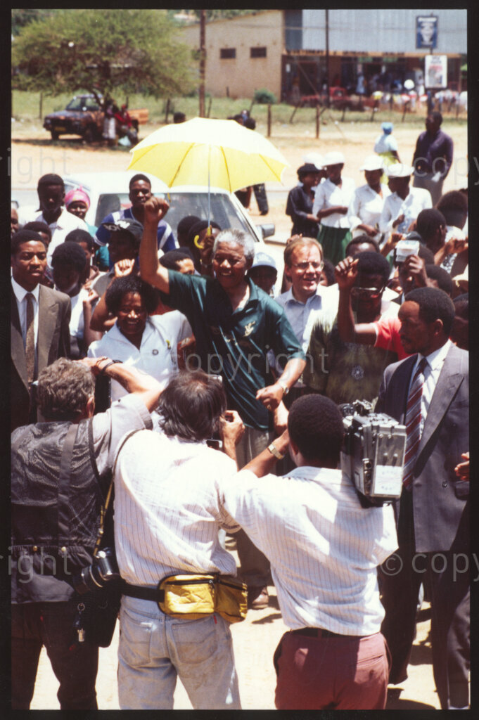 Jane Furse Hospital, Jane Furse, Sekhukhuneland, Transvaal, South Africa, 19921130. PHOTO: ANC Archives.

Crowds escort the President of the African National Congress (ANC), Nelson Mandela (centre), and Carl Niehaus of the ANC, through the grounds of the Jane Furse Hospital on a visit to the town in November 1992.