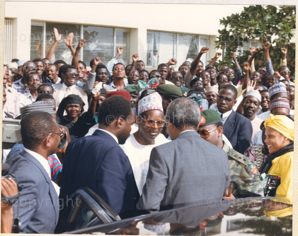 Kaduna Refinery, Kaduna, Kaduna, Nigeria, 19900515. PHOTO: ANC Archives.

Nelson Mandela (center) greets an unidentified individual, as crowds cheers in the background, during his visit to Kaduna Refinery, Nigeria, 15 May 1990.