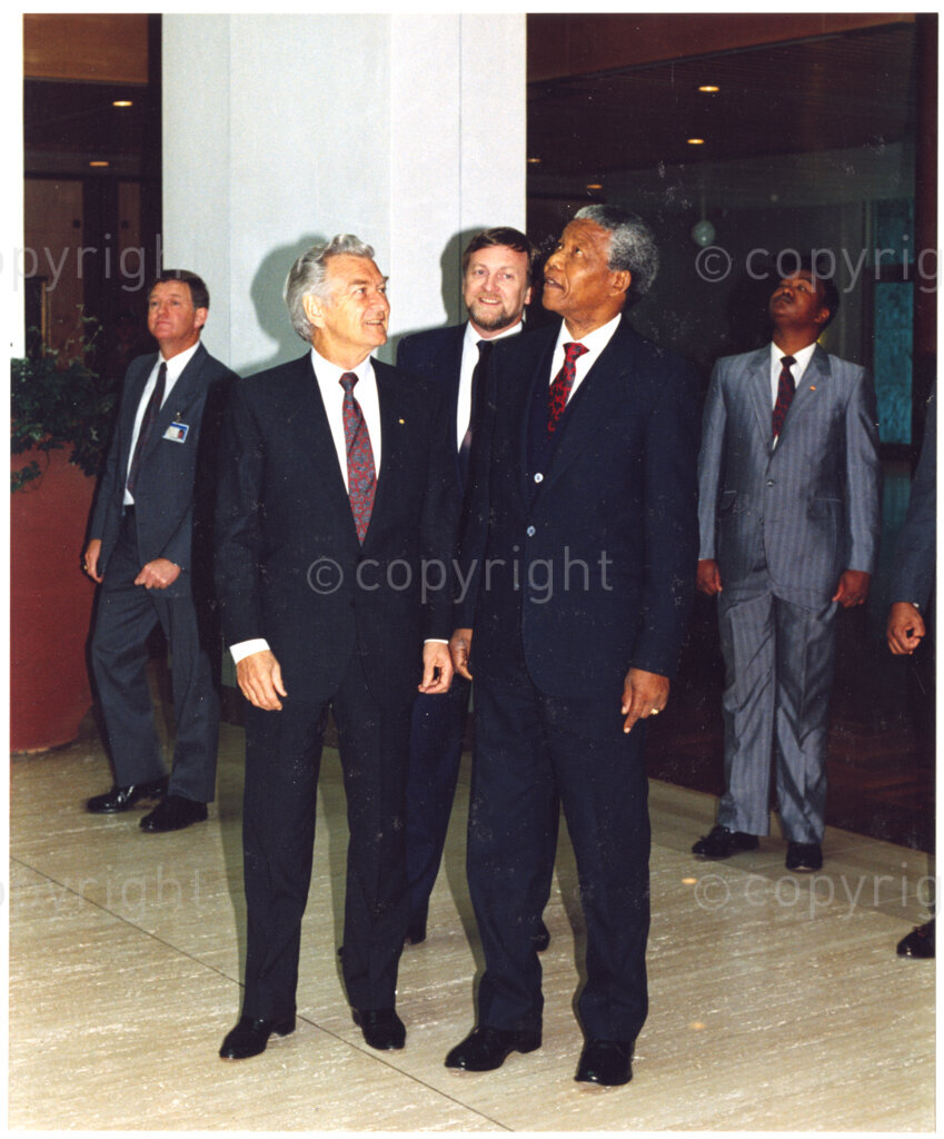 Australia, October 1990. PHOTO: ANC Archives: Australian Prime Minister, Bob Hawke, (front and left), and Nelson Mandela, (second from the right), (Deputy President of the African National Congress). Mandela expresses his thanks to Hawke, leader of the Australian Labour Party, for their activism against the oppressive apartheid government, during the years of Mandela's incarceration. The irony is that Australia is experiencing its own discriminatory problems in respect of its treatment of Aborigines. Monday 22 October to Saturday 27 October 1990.