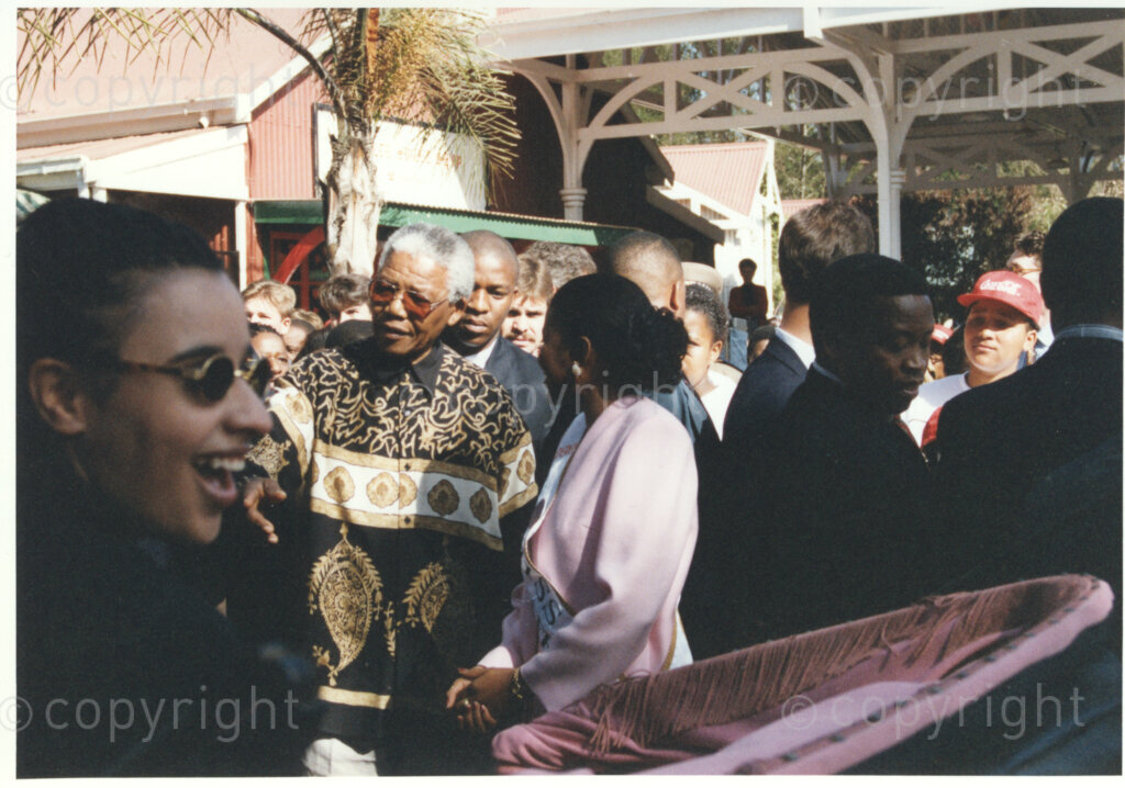 Gold Reef City, Johannesburg, Gauteng, South Africa, 19950717. PHOTO: ANC Archives.

The President of South Africa, Nelson Mandela, enjoys a moment with Miss South Africa (1994), Ms Basetsana Makgalemele, as they arrive at his 77th birthday celebration at Gold Reef City, Johannesburg, on Monday the 17th July 1995. More than 2,000 underprivileged children, including 34 children who are currently imprisoned, street children, children from orphanages, mentally disabled children and children who have been abused, have been invited to attend his birthday celebration with him. Nelson Mandela is attending this function in his personal capacity as he places special emphasis on the plight of children. Nelson Mandela was born on the 18th July 1918 in Mvezo, a small village in the Eastern Cape.