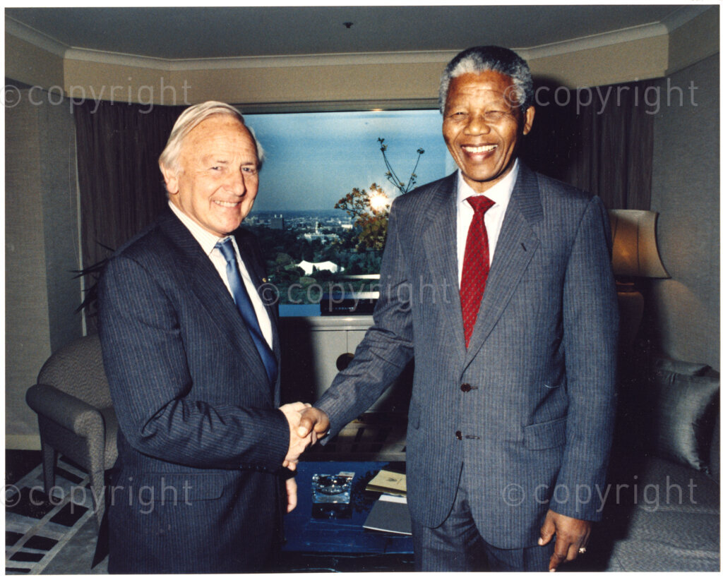 Australia, October 1990. PHOTO: ANC Archives: A distinctly happy Nelson Mandela, (right), Deputy President of the African National Congress, greets an Australian dignitary during his 1990 visit to Australia. Mandela is there to express his gratitude to those who have staunchly supported him and the ANC during his 27 year period of incarceration. Monday 22 October to Saturday 27 October 1990.