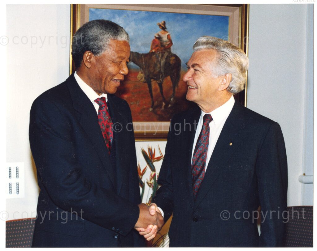 Australia, October 1990. PHOTO: ANC Archives: During his 1990 visit to Australia, Nelson Mandela, Deputy President of the African National Congress, expresses his gratitude to Prime Minister Bob Hawke for the ongoing support Mandela and the ANC receive from the Australian Labour Party during his 27 year jail sentence. This was done by imposing economic and political sanctions on the South African apartheid regime. Monday 22 October to Saturday 27 October 1990.